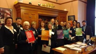 Amie Hatfield and other library representatives with Jay Hottinger